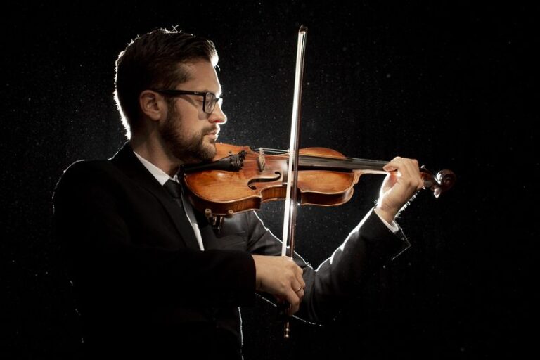 side-view-male-artist-playing-violin
